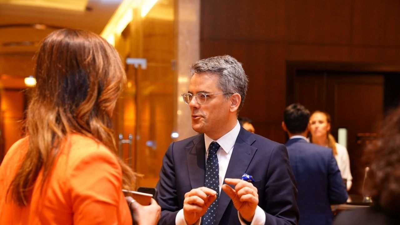 Two delegates talking together during a break